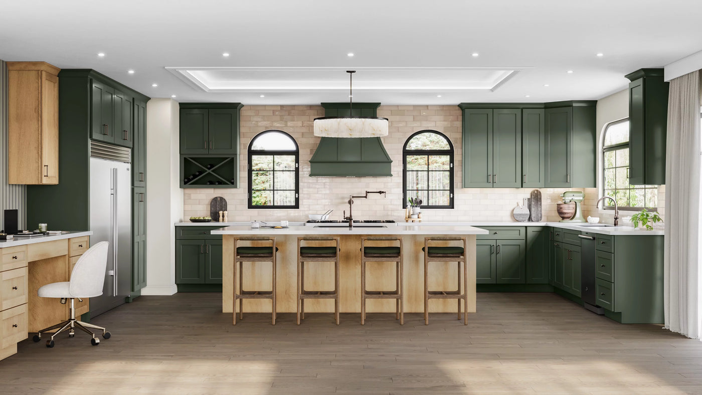 Shaker ivy green kitchen cabinets, wooden floors, and stainless steel appliances.
