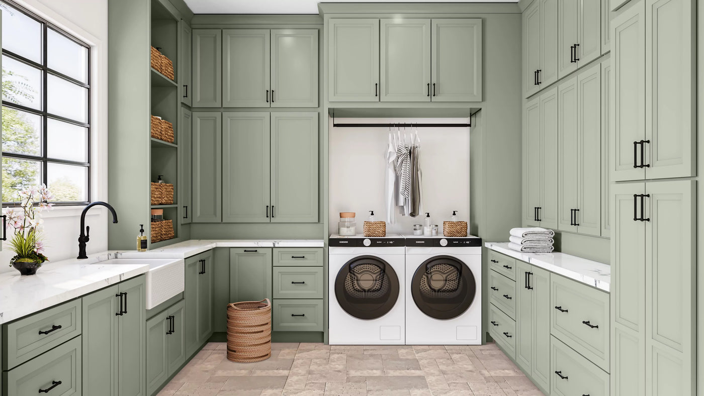 Modern laundry room with green cabinets and white appliances