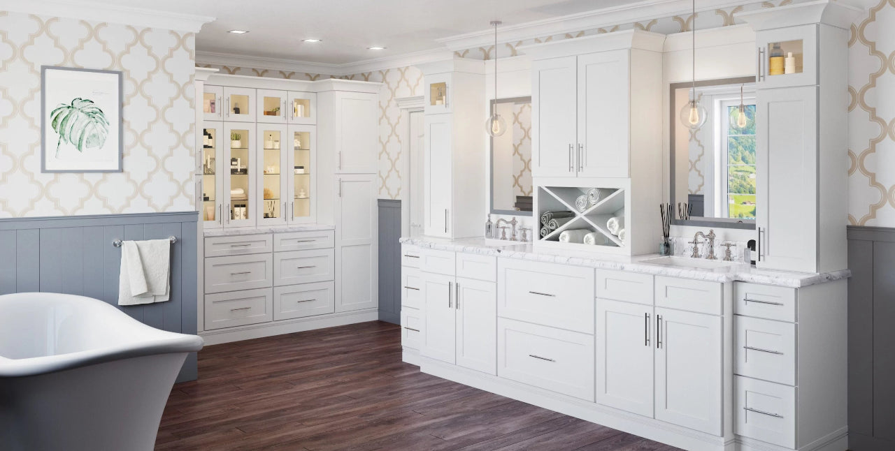 US Cabinet Depot Shaker White bathroom with clawfoot tub and lit glass cabinets